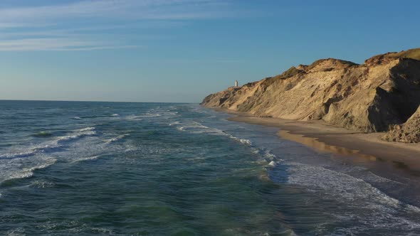 Drone Flight Over Coastline To Rubjerg Knude Lighthouse Hjorring Denmark