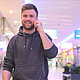 Young Man Walking and Talking on the Phone in a Mall - VideoHive Item for Sale