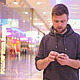 Young Man Walking and Looking at the Phone - VideoHive Item for Sale