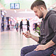 Young Man Sitting and Looking at the Phone - VideoHive Item for Sale
