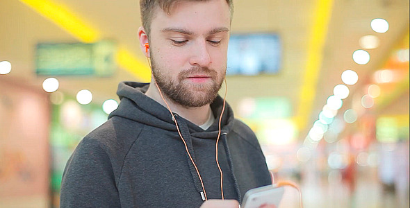 Young Man Listening to Music with Headphones