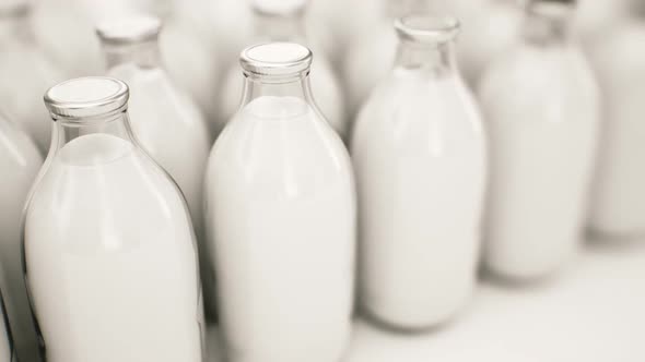 Endless animation of bottles with natural milk infinite array. Loopable. HD