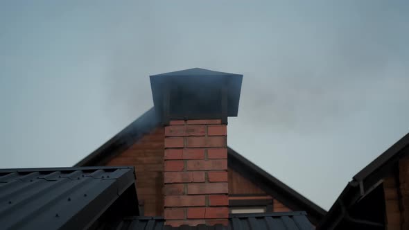 Close Up View of House Chimney with Smoke
