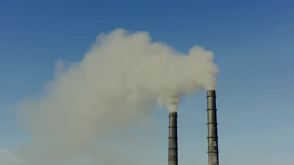 Aerial Drone View of Emission to Atmosphere From Industrial Pipes