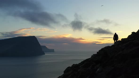 Drone Over Hiking Man At Sunset On Villingadalsfjall