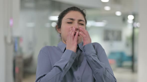 Portrait of Young Indian Woman Sneezing