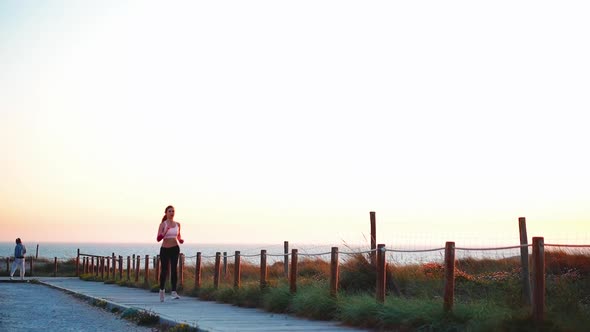 Runner Woman Running Sunny Path Road Near Ocean