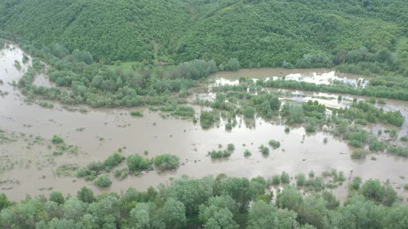 Widely flooded river coastal area and forest 4K aerial video