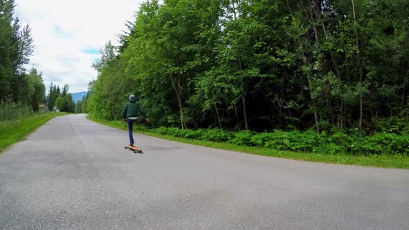 Man rides a skateboard on the road 4k