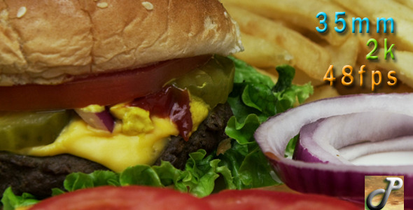 Cheeseburger With Onions Fries And Tomatoes