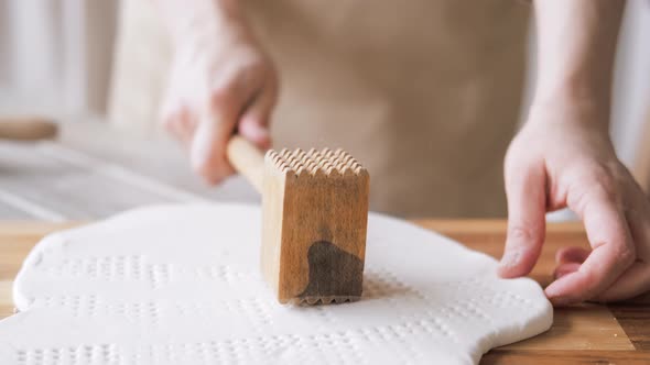 Handcraft Woman Master Modeling Cold Porcelain Hands Makes Pattern and Texture on the Dough Beats It