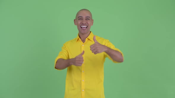 Happy Handsome Bald Businessman Giving Thumbs Up and Looking Excited