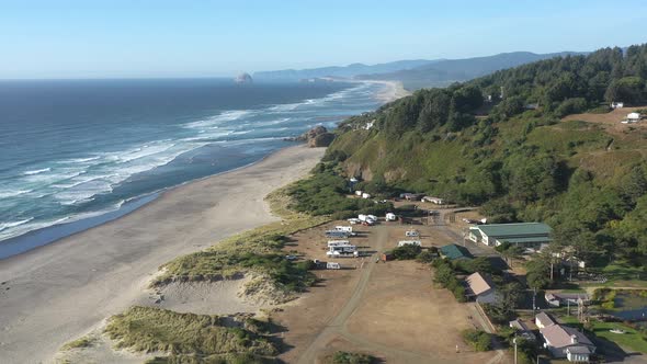 RV trailer park next to the beach with scenic and stunning landscape formation at Oregon Coast.