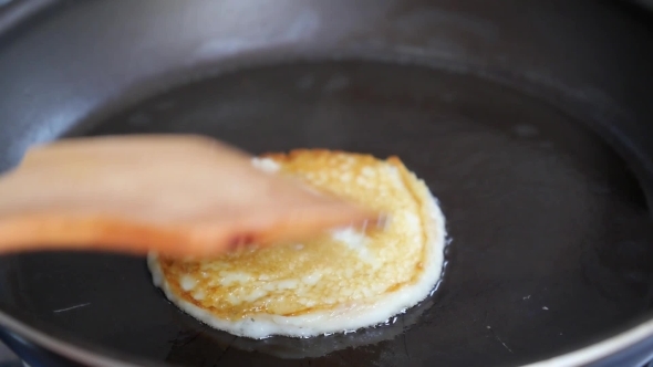Making Pancake, Crepes, Flapjack On Frying Pan