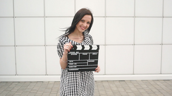 Girl With Cinema Slate Board Posing