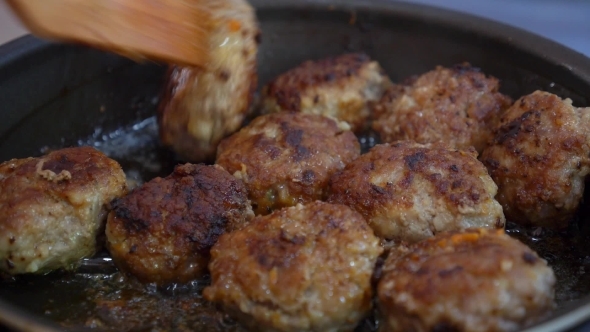 Fresh Meat Cutlets In a Frying Pan Grill