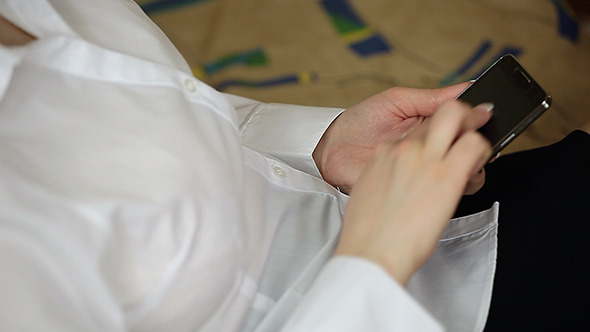 Woman Using Touch Screen Smartphone