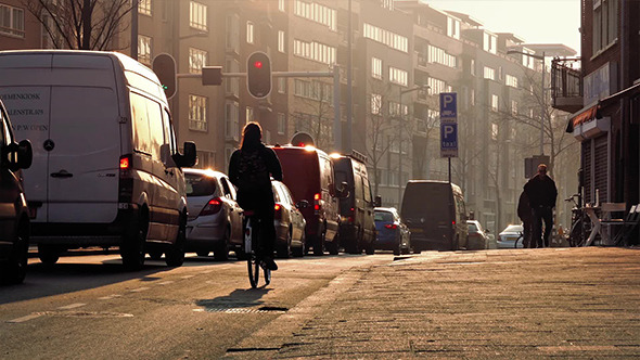 People And Cars In Sunny Downtown