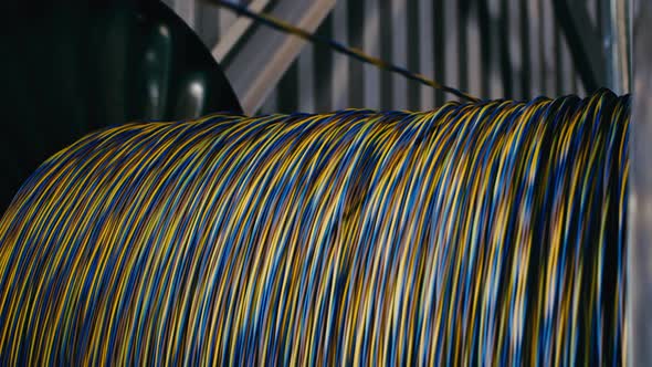 Spinning Reel with Cable in Cable Production Plant Closeup