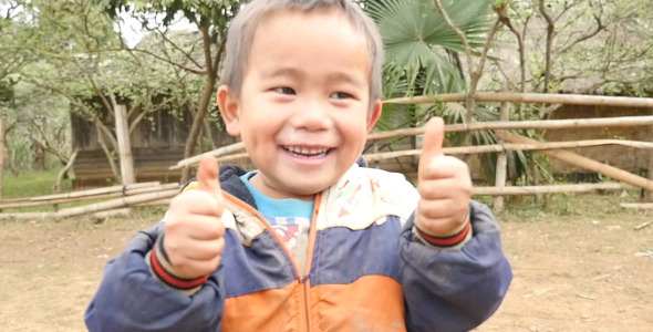 Poor Little Boy Making Thumbs Up Gesture