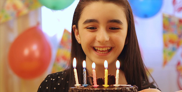 Girl Enjoying Birthday Cake