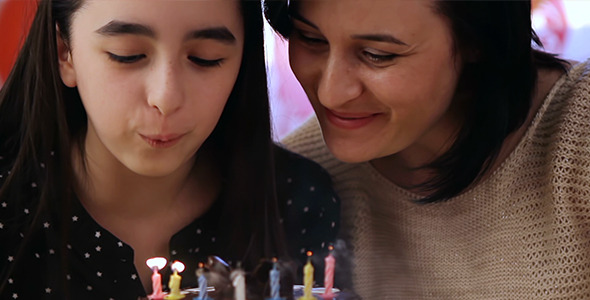 Mother and Daughter with Birthday Cake