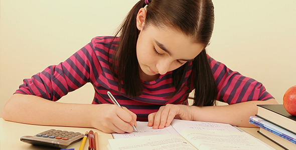 Cute Schoolgirl Doing Her Homework