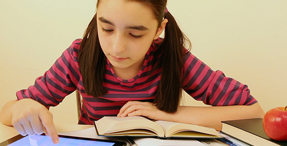 Schoolgirl Studying with Tablet Pc