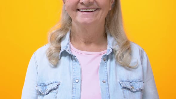 Happy Senior Female in Casual Clothes on Bright Background, Positivity Wellness