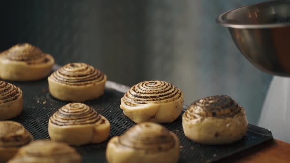 Woman making cinnabon in the kitchen