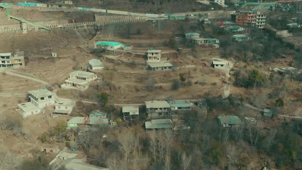 Aerial View Over Buildings In Muzaffarabad City Of Azad Kashmir In Pakistan. Dolly Forward