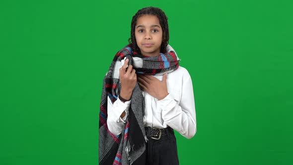 Ill African American Teen Girl Spraying Throat Spray on Green Screen Showing Thumb Up Smiling