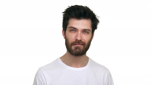 Caucasian Male Looking Straight Nodding with Affection on White Background