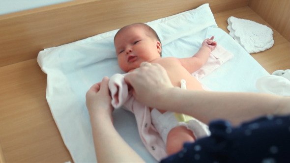 Newborn Girl Dress Clothes on The Changing Table