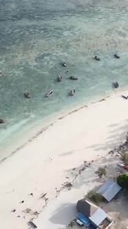 Vertical Video Boats in the Ocean Near the Coast of Zanzibar Tanzania