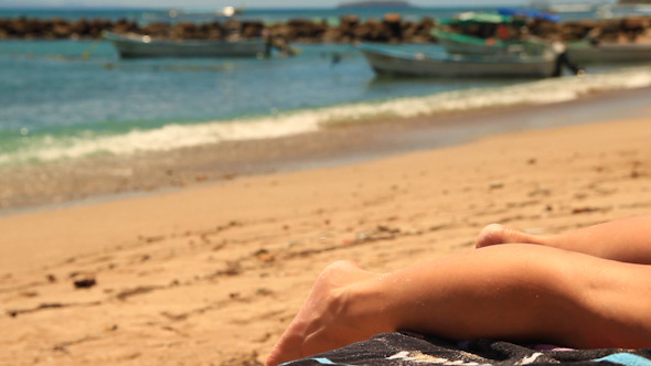 Legs of a Woman Sunbathing