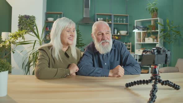 An Elderly Couple Is Vlogging Making Content For Vlogging in a Cozy Living Room