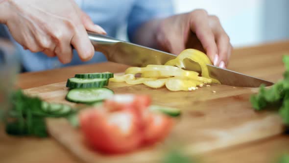 Close Up Female Hands Chopping Yellow Sweet Pepper Cooking Salad