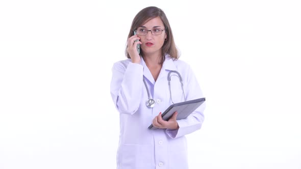 Beautiful Woman Doctor Multitasking at Work