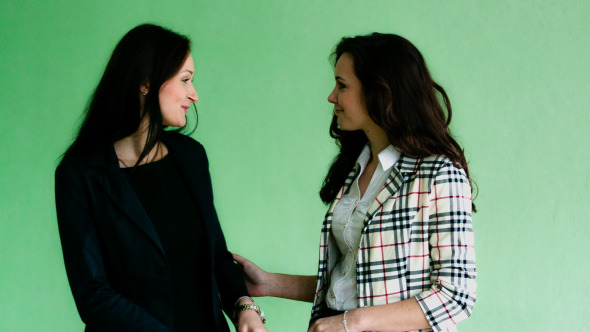 The Meeting Of Two Women In Business Suits