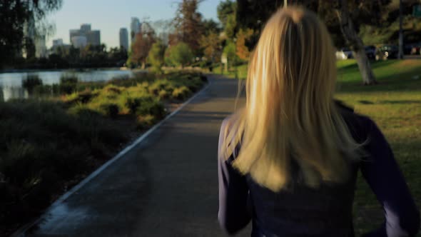 Athletic Woman Jogging In The Park