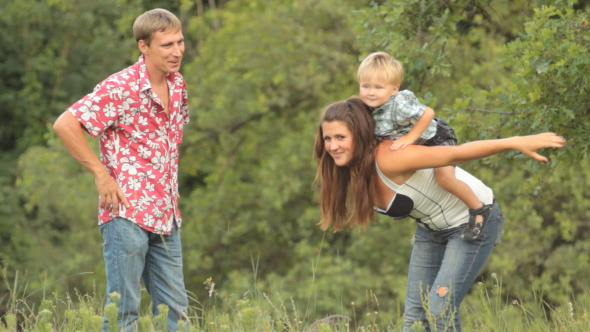 Mother With His Little Son In Nature