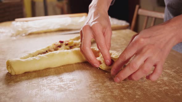 Women's Hands Knead Dough for Easter Cakes