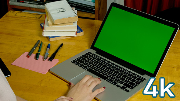 Girl Using Laptop with Green Screen