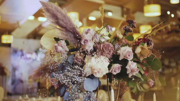 A Serving Tables Decorated with a Bouquet of Pastel Flowers Slow Motion