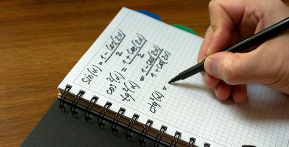 A Man Writes in a Notebook, a Mathematical Formula