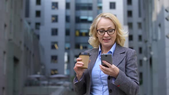 Senior Office Worker Looking Excited Reading Good News Smartphone, Business App