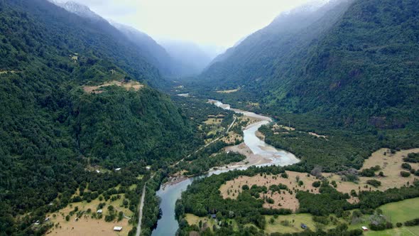 Aerial orbit of the Cochamo Valley on a cloudy day, Chile. Cochamo River.