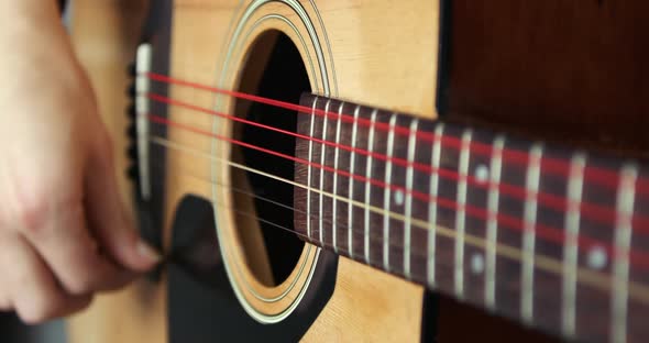 Strumming a Guitar Close Up in Super Slow Motion 300Fps