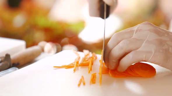 Knife Quickly Cuts Carrot.